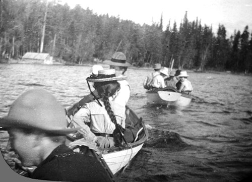 Early students at FLBS canoe across Yellow Bay