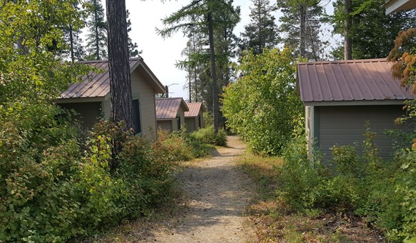 View of walking path between lakeshore cabins