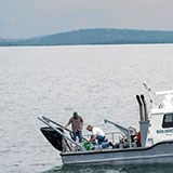 Researchers sampling from the Jessie B research vessel on Flathead Lake