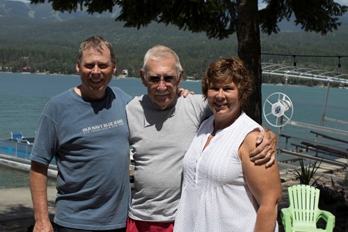Former FLBS director Dick Solberg stands with his kids Sannon and Jenanne at Whitefish Lake