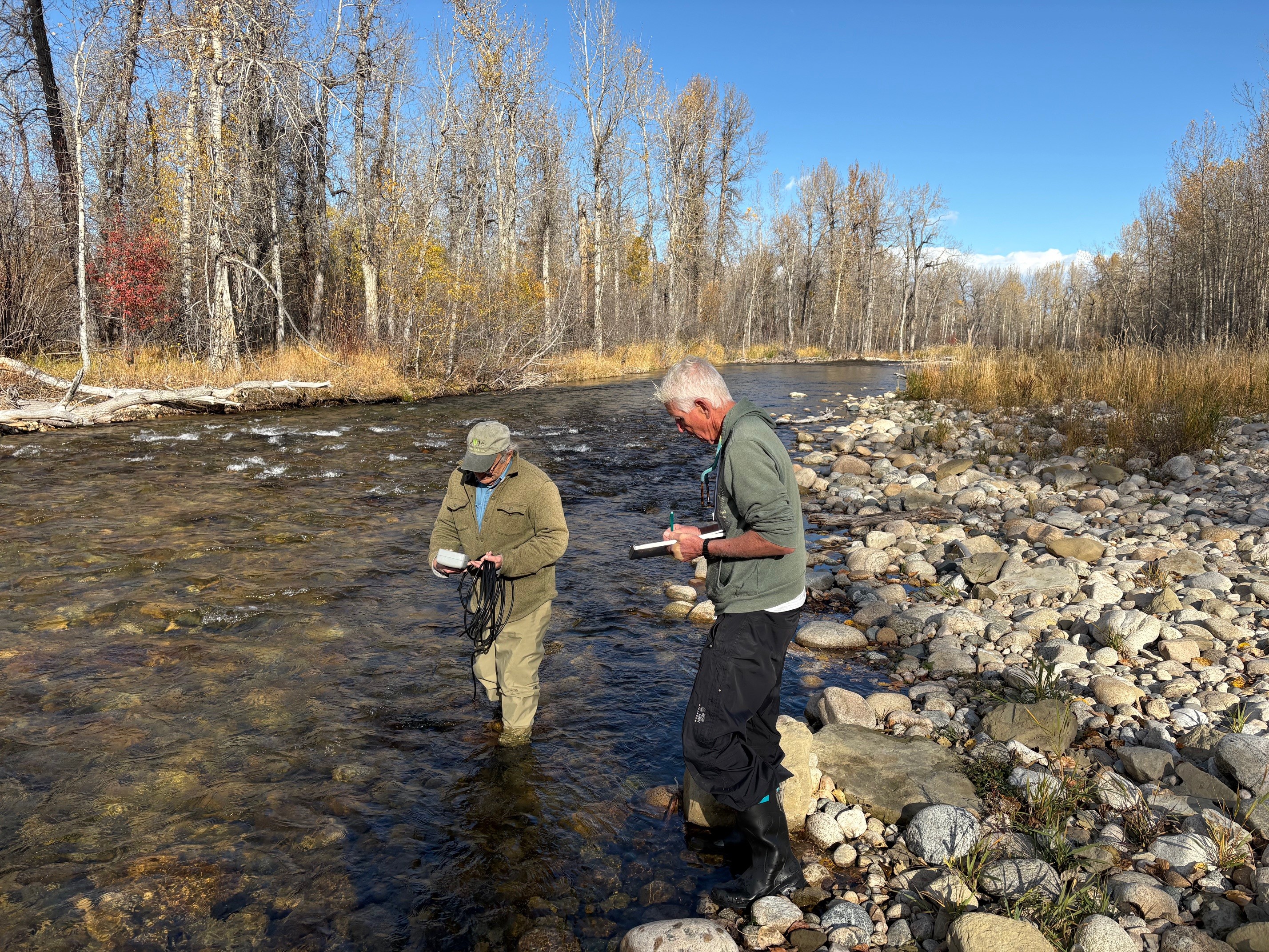 Jeff DiBenedetto showing a Carbon County Resource Council member how to record data with a flow meter.