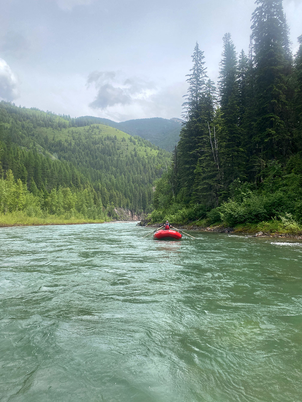 Jeremy rows a raft on the upper Middle Fork Flathead River, 2020