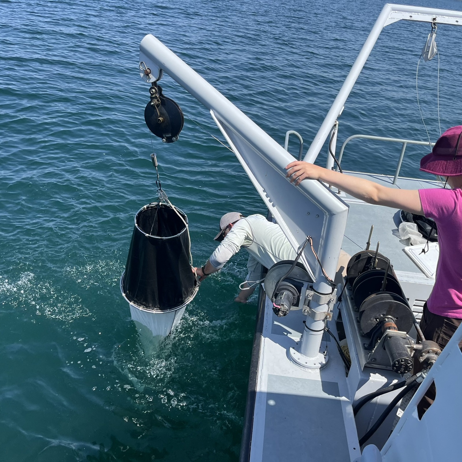FLBS scientists aboard a research vessel collect water samples from Flathead Lake