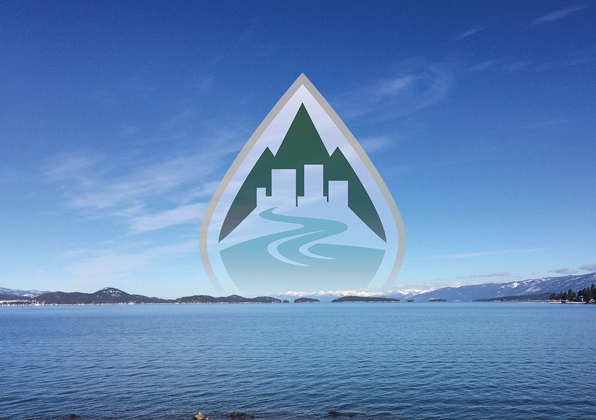 Image of Polson Bay with a semitransparent modified business version of the FLBS water drop logo hovering in the middle