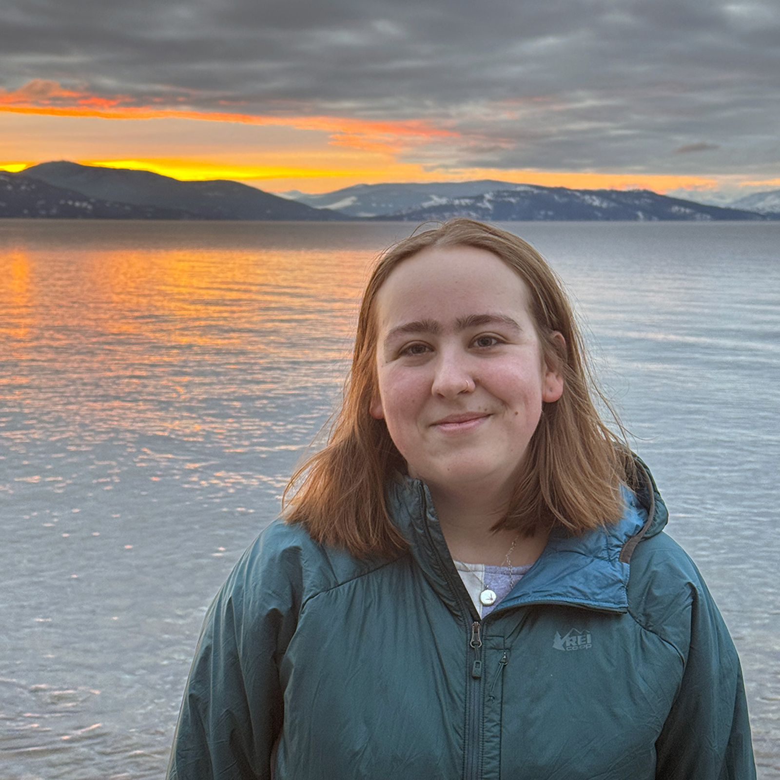 Chloe by Flathead Lake at sunset