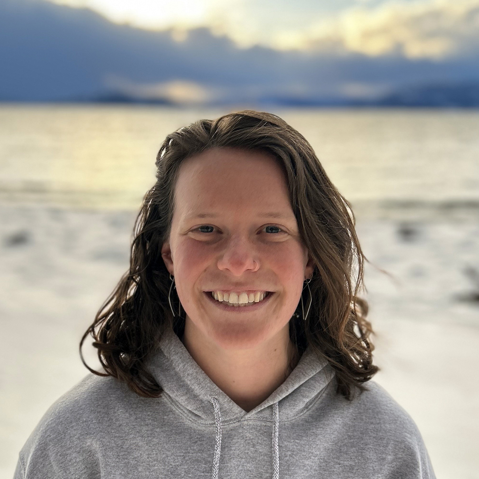 Carolyn Lober by a snowy Flathead Lake shoreline
