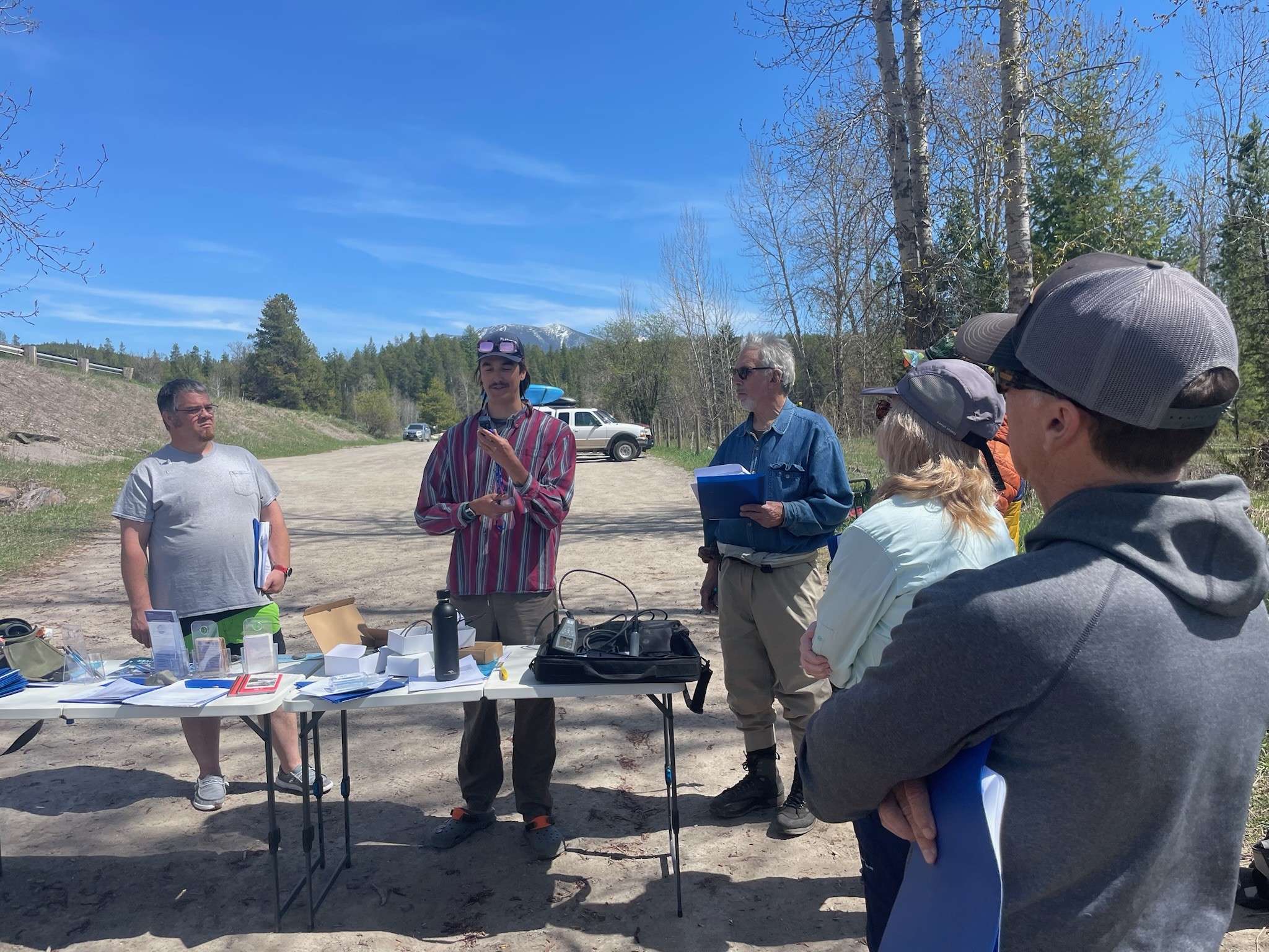 Geoffrey with Flathead Rivers Alliance instructing Flathead Rivers Alliance volunteers on how to use a YSI probe.