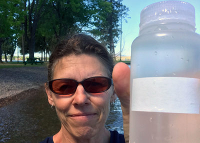 Dana Johnston collects a water sample