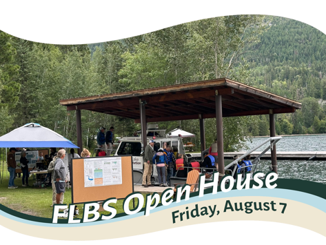 People gather around science exhibits on lake shoreline